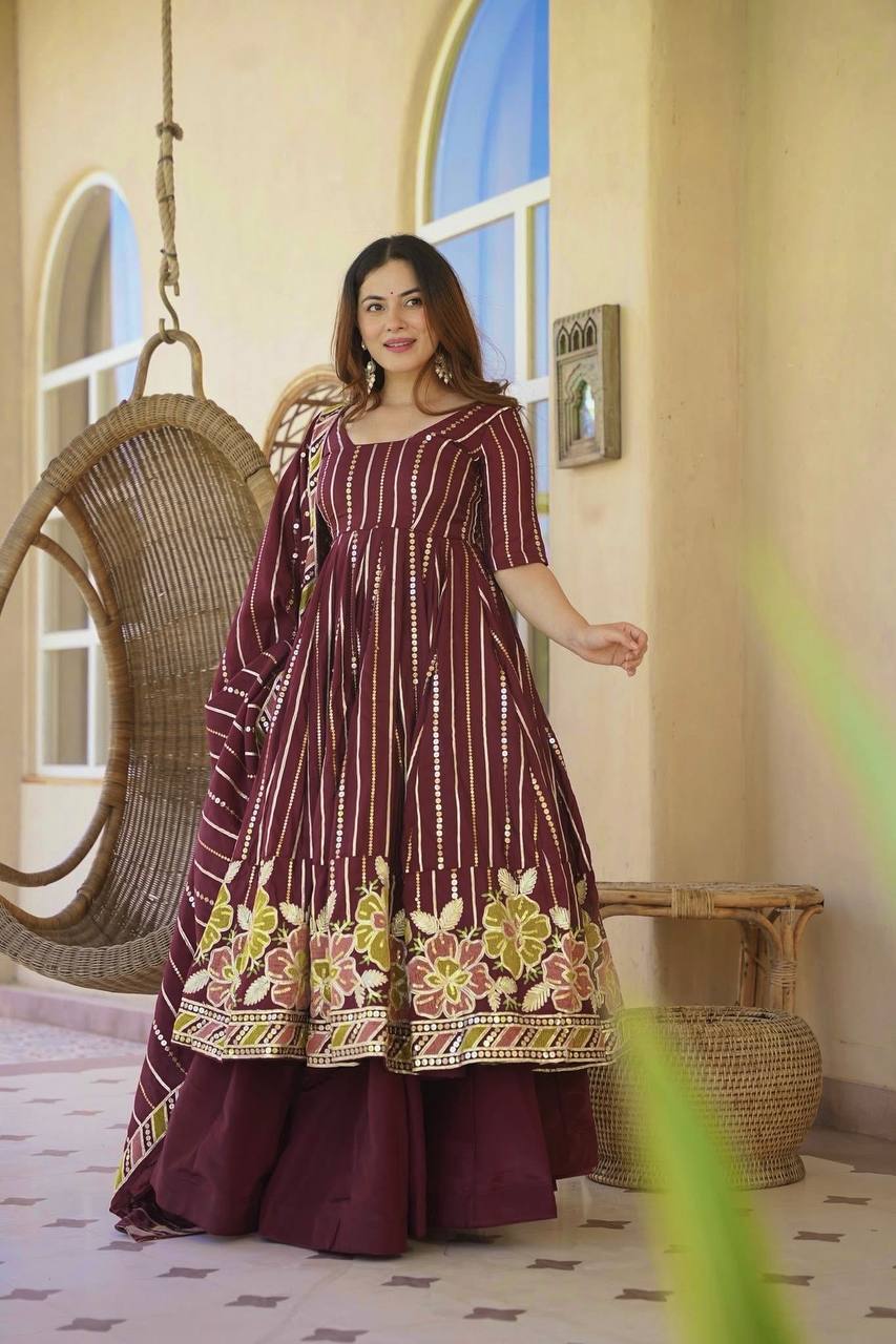 Majestic Maroon Flared Anarkali Suit Set Adorned with Luminous Sequin Stripes and an Ornate Floral Embroidered Hemline